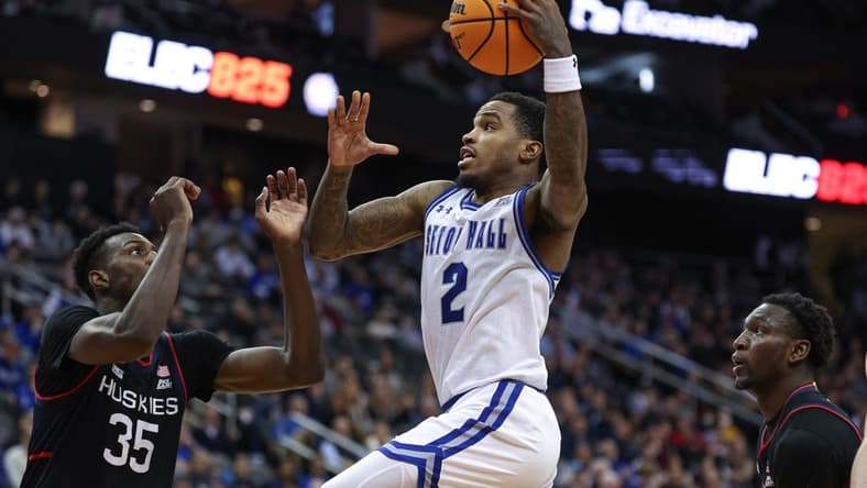 Dec 20, 2023; Newark, New Jersey, USA; Seton Hall Pirates guard Al-Amir Dawes (2) drives to the basket as Connecticut Huskies forward Samson Johnson (35) defends during the second half at Prudential Center. Mandatory Credit: Vincent Carchietta-USA TODAY Sports