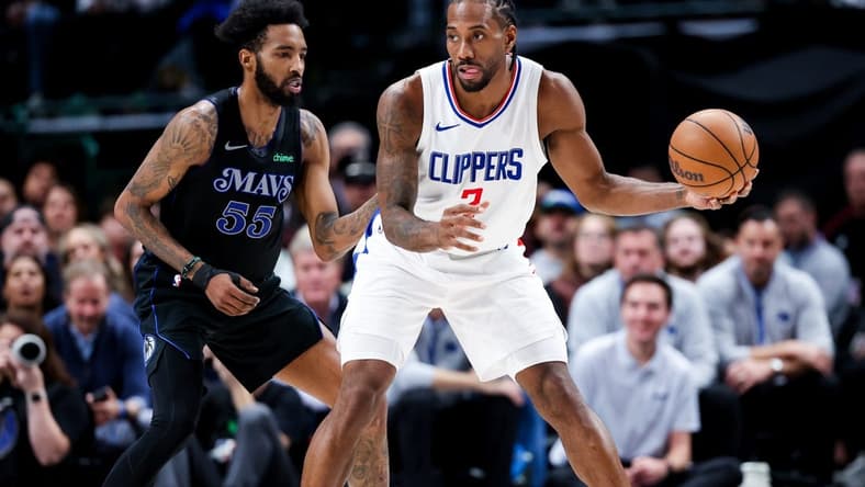 Dec 20, 2023; Dallas, Texas, USA; LA Clippers forward Kawhi Leonard (2) controls the ball as Dallas Mavericks forward Derrick Jones Jr. (55) defends during the second quarter at American Airlines Center. Mandatory Credit: Kevin Jairaj-USA TODAY Sports