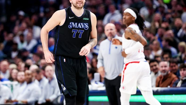 Dec 20, 2023; Dallas, Texas, USA;  Dallas Mavericks guard Luka Doncic (77) reacts after scoring during the second quarter against the LA Clippers at American Airlines Center. Mandatory Credit: Kevin Jairaj-USA TODAY Sports