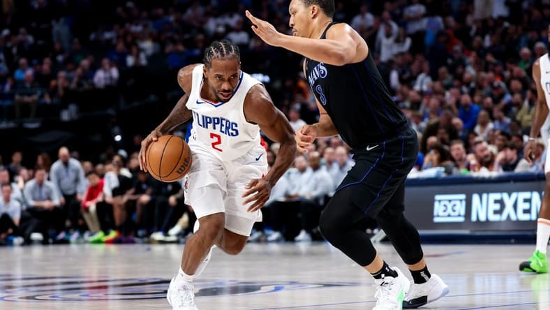 Dec 20, 2023; Dallas, Texas, USA; LA Clippers forward Kawhi Leonard (2) controls the ball as Dallas Mavericks forward Grant Williams (3) defends during the second half at American Airlines Center. Mandatory Credit: Kevin Jairaj-USA TODAY Sports