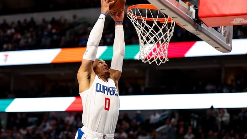 Dec 20, 2023; Dallas, Texas, USA; LA Clippers guard Russell Westbrook (0) dunks the ball during the second half against the Dallas Mavericks at American Airlines Center. Mandatory Credit: Kevin Jairaj-USA TODAY Sports