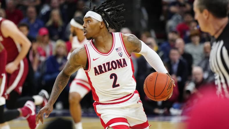 Arizona guard Caleb Love (2) dribbles up the court against Alabama during the Jerry Colangelo Hall of Fame Series at the Footprint Center on Dec. 20, 2023.