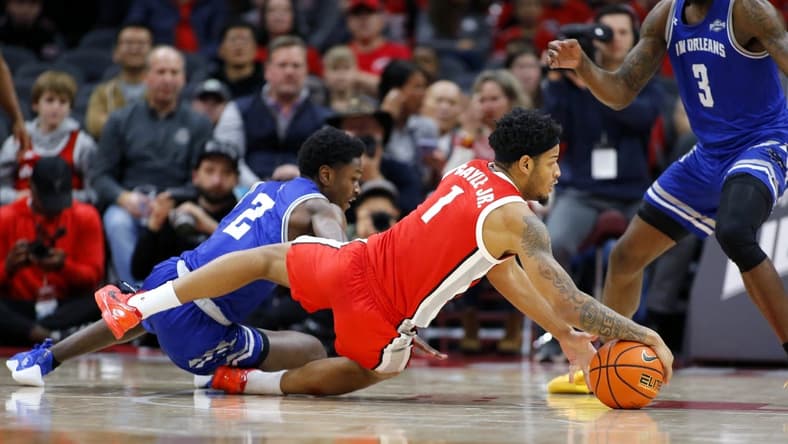 Dec 21, 2023; Columbus, Ohio, USA; Ohio State Buckeyes guard Roddy Gayle Jr. (1) dives for the ball as New Orleans Privateers guard Jah Short (2) defends during the first half at Value City Arena. Mandatory Credit: Joseph Maiorana-USA TODAY Sports