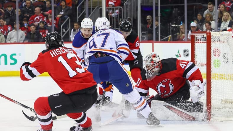 Dec 21, 2023; Newark, New Jersey, USA; New Jersey Devils goaltender Vitek Vanecek (41) makes a save on Edmonton Oilers center Connor McDavid (97) during the first period at Prudential Center. Mandatory Credit: Ed Mulholland-USA TODAY Sports