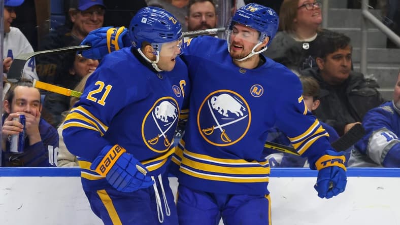 Dec 21, 2023; Buffalo, New York, USA; Buffalo Sabres right wing Kyle Okposo (21) celebrates his shorthanded goal with defenseman Connor Clifton (75) during the second period against the Toronto Maple Leafs at KeyBank Center. Mandatory Credit: Timothy T. Ludwig-USA TODAY Sports