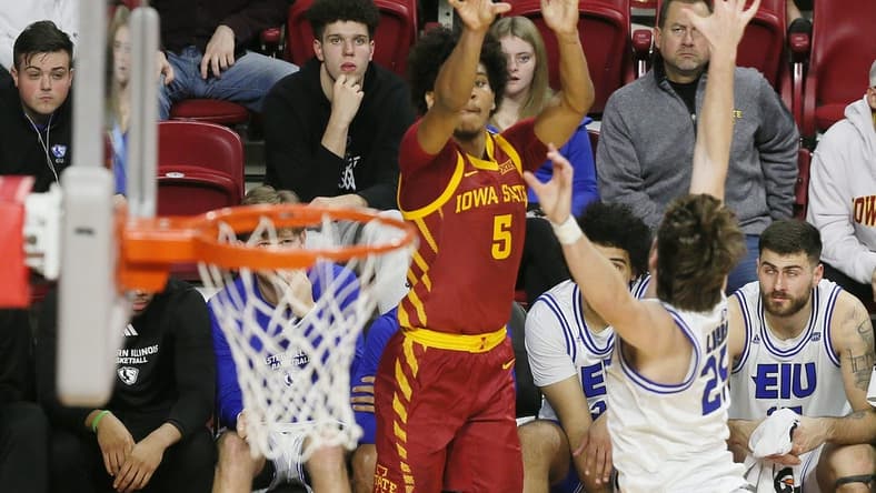 Iowa State Cyclones guard Curtis Jones (5) takes a three-point shot over Eastern Illinois Panthers guard Dan Luers (25) during the first half of a NCAA college basketball at Hilton Coliseum on Thursday, Dec. 21, 2023, in Ames, Iowa.