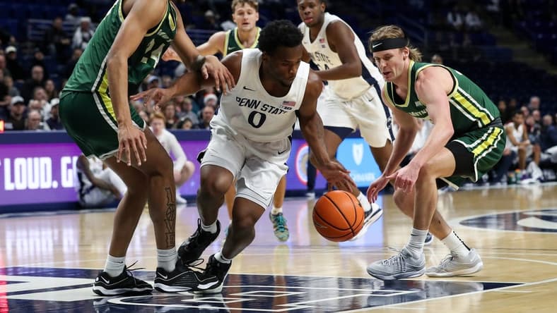 Dec 21, 2023; University Park, Pennsylvania, USA; Penn State Nittany Lions guard Kanye Clary (0) tries to maintain control of the ball during the first half against the Le Moyne Dolphins at Bryce Jordan Center. Penn State defeated Le Moyne 72-55. Mandatory Credit: Matthew O'Haren-USA TODAY Sports