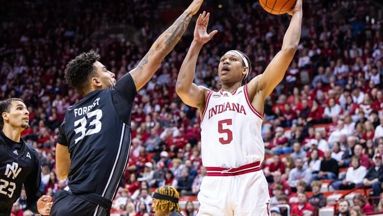 Dec 21, 2023; Bloomington, Indiana, USA; Indiana Hoosiers forward Malik Reneau (5) shoots the ball while North Alabama Lions forward Damian Forrest (33) defends in the first half at Simon Skjodt Assembly Hall. Mandatory Credit: Trevor Ruszkowski-USA TODAY Sports