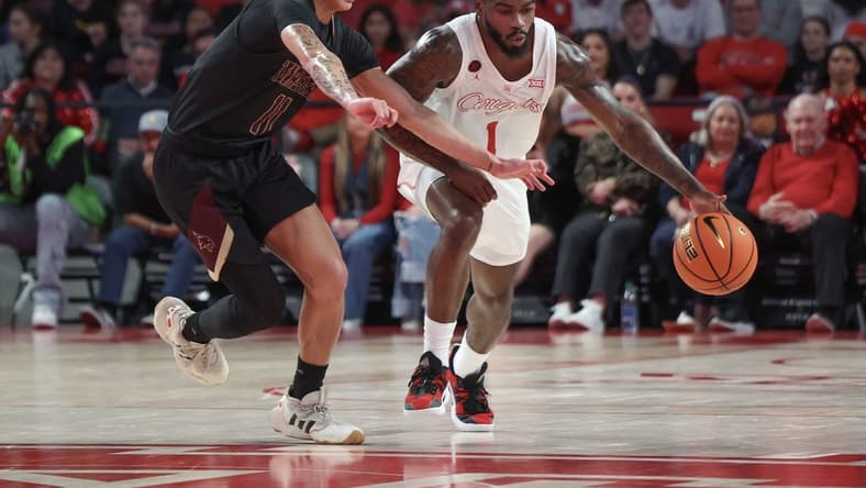 Dec 21, 2023; Houston, Texas, USA; Houston Cougars guard Jamal Shead (1) dribbles against Texas State Bobcats guard Kaden Gumbs (11) in the second half at Fertitta Center. Mandatory Credit: Thomas Shea-USA TODAY Sports