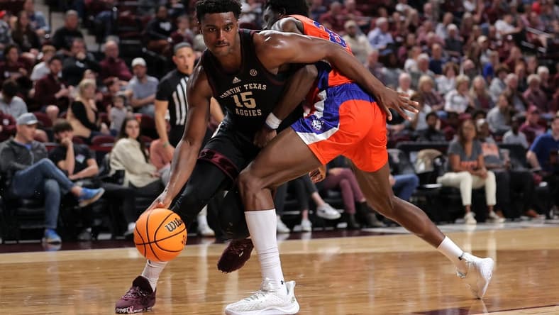 Dec 22, 2023; College Station, Texas, USA; Texas A&M Aggies forward Henry Coleman III (15) handles the ball inside against Houston Christian Huskies forward Chigozie Achara (20) during the first half at Reed Arena. Mandatory Credit: Erik Williams-USA TODAY Sports