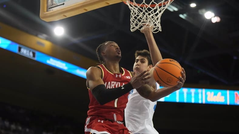Dec 22, 2023; Los Angeles, California, USA; Maryland Terrapins guard Jahmir Young (1) shoots the ball against UCLA Bruins center Aday Mara (15) in the first half at Pauley Pavilion presented by Wescom. Mandatory Credit: Kirby Lee-USA TODAY Sports