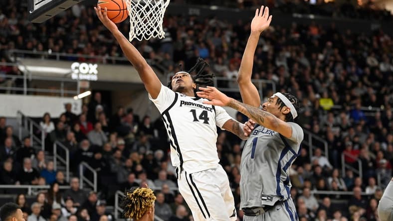 Dec 23, 2023; Providence, Rhode Island, USA; Providence Friars guard Corey Floyd Jr. (14) shoots the ball against the Butler Bulldogs during the first half at Amica Mutual Pavilion. Mandatory Credit: Eric Canha-USA TODAY Sports