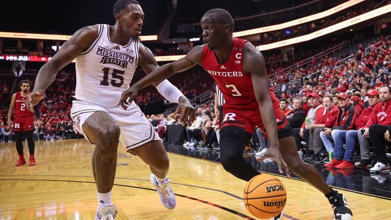 Dec 23, 2023; Newark, NY, USA; Rutgers Scarlet Knights forward Mawot Mag (3) dribbles against Mississippi State Bulldogs forward Jimmy Bell Jr. (15) during the first half at Prudential Center. Mandatory Credit: Vincent Carchietta-USA TODAY Sports