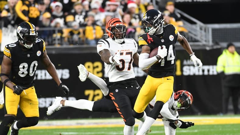 Dec 23, 2023; Pittsburgh, Pennsylvania, USA; Pittsburgh Steelers wide receiver George Pickens outpaces the Cincinnati Bengals defense for an 86 yard touchdown in the first quarter at Acrisure Stadium. Mandatory Credit: Philip G. Pavely-USA TODAY Sports