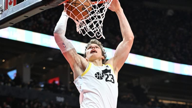 Dec 23, 2023; Toronto, Ontario, CAN; Utah Jazz forward Lauri Markkanen (23) dunks for a basket against the Toronto Raptors in the second half at Scotiabank Arena. Mandatory Credit: Dan Hamilton-USA TODAY Sports