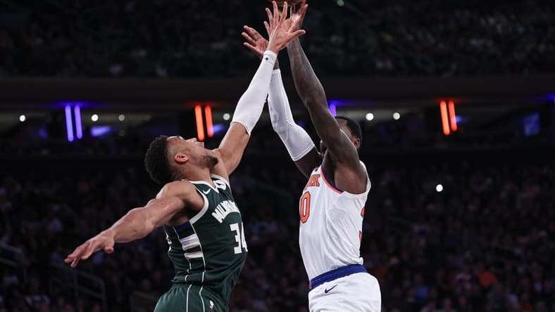 Dec 25, 2023; New York, New York, USA; New York Knicks forward Julius Randle (30) shoots the ball as Milwaukee Bucks forward Giannis Antetokounmpo (34) defends during the first half at Madison Square Garden. Mandatory Credit: Vincent Carchietta-USA TODAY Sports