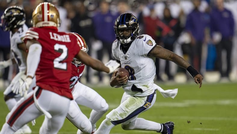 Dec 25, 2023; Santa Clara, California, USA; Baltimore Ravens quarterback Lamar Jackson (8) scrambles with the football against San Francisco 49ers safety Ji'Ayir Brown (27) during the second quarter at Levi's Stadium. Mandatory Credit: Neville E. Guard-USA TODAY Sports