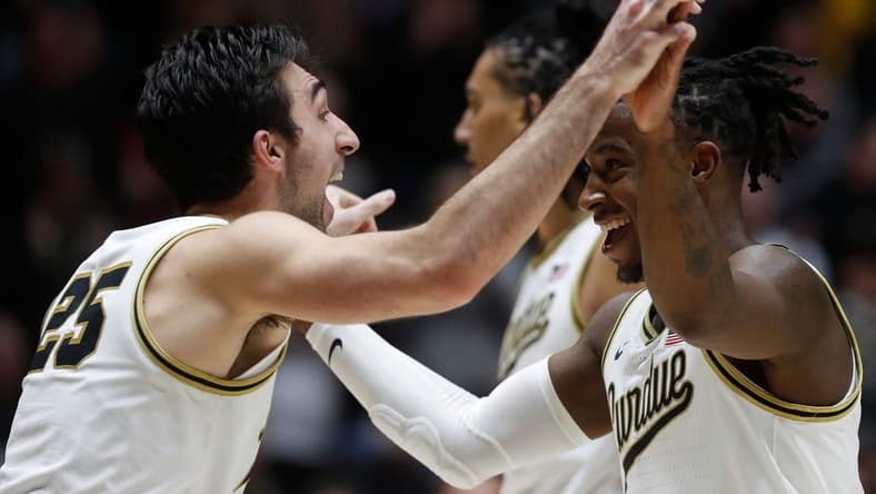 Purdue Boilermakers guard Ethan Morton (25) and Purdue Boilermakers guard Lance Jones (55) celebrate during the NCAA men s basketball game against the Iowa Hawkeyes, Monday, Dec. 4, 2023, at Mackey Arena in West Lafayette, Ind. Purdue Boilermakers 87-68.