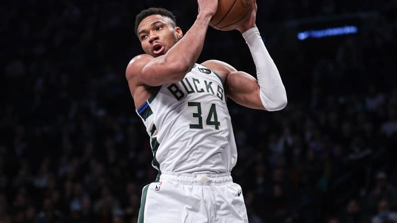 Dec 27, 2023; Brooklyn, New York, USA; Milwaukee Bucks forward Giannis Antetokounmpo (34) rebounds during the first quarter against the Brooklyn Nets at Barclays Center. Mandatory Credit: Vincent Carchietta-USA TODAY Sports