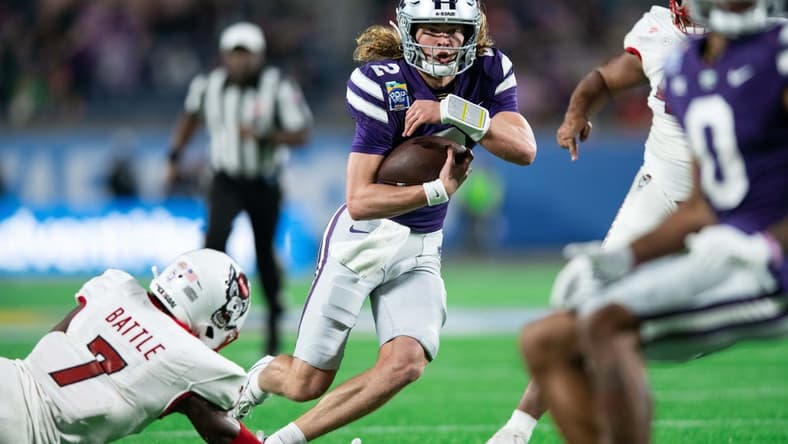 Dec 28, 2023; Orlando, FL, USA; Kansas State quarterback Avery Johnson (2) runs for the touchdown against NC State in the second quarter at Camping World Stadium. Mandatory Credit: Jeremy Reper-USA TODAY Sports