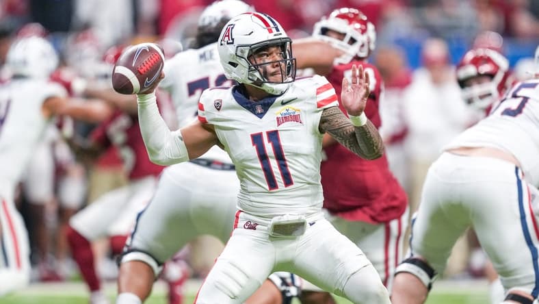 Dec 28, 2023; San Antonio, TX, USA; Arizona Wildcats quarterback Noah Fifita (11) throws a pass in the first half against the Oklahoma Sooners at Alamodome. Mandatory Credit: Daniel Dunn-USA TODAY Sports