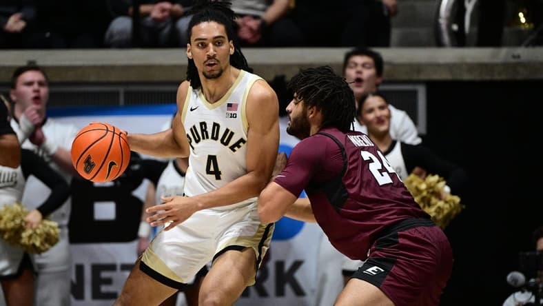 Dec 29, 2023; West Lafayette, Indiana, USA; Purdue Boilermakers forward Trey Kaufman-Renn (4) leans into Eastern Kentucky Colonels forward Michael Moreno (24) during the first half at Mackey Arena. Mandatory Credit: Marc Lebryk-USA TODAY Sports