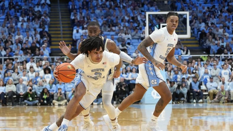 Dec 29, 2023; Chapel Hill, North Carolina, USA; North Carolina Tar Heels guard Elliot Cadeau (2) dribbles in the first half at Dean E. Smith Center. Mandatory Credit: Bob Donnan-USA TODAY Sports