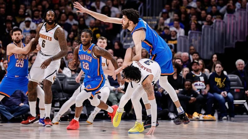 Dec 29, 2023; Denver, Colorado, USA; Oklahoma City Thunder forward Chet Holmgren (7) and Denver Nuggets guard Julian Strawther (3) battle for the ball in the second quarter at Ball Arena. Mandatory Credit: Isaiah J. Downing-USA TODAY Sports