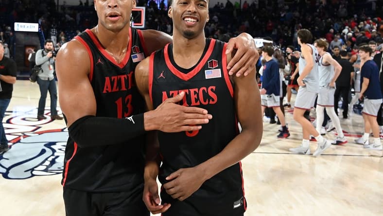 Dec 29, 2023; Spokane, Washington, USA; San Diego State Aztecs forward Jaedon LeDee (13) and guard Micah Parrish (3) celebrate after a game against the Gonzaga Bulldogs at McCarthey Athletic Center. San Diego won 84-74. Mandatory Credit: James Snook-USA TODAY Sports