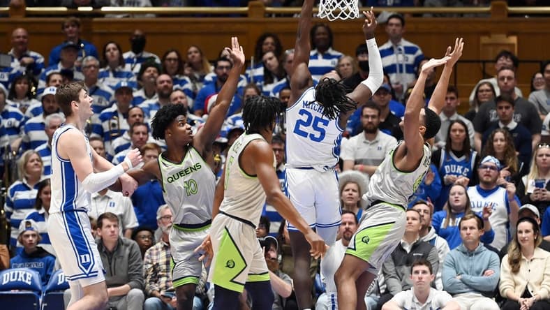 Dec 30, 2023; Durham, North Carolina, USA; Duke Blue Devils forward Mark Mitchell (25) shoots during the first half against the Queens Royals at Cameron Indoor Stadium. Mandatory Credit: Rob Kinnan-USA TODAY Sports