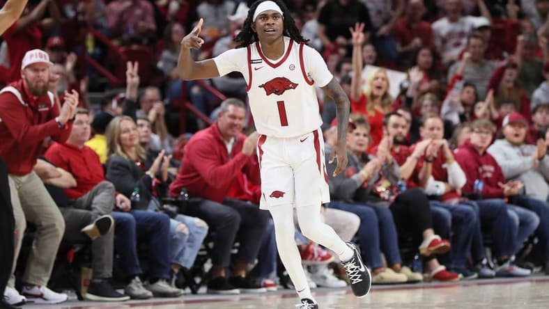 Dec 30, 2023; Fayetteville, Arkansas, USA; Arkansas Razorbacks guard Keyon Menifield Jr (1) celebrates after making a three point shot in the first half against the UNC Wilmington Seahawks at Bud Walton Arena. Mandatory Credit: Nelson Chenault-USA TODAY Sports