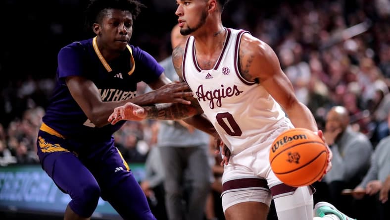 Dec 30, 2023; College Station, Texas, USA; Texas A&M Aggies guard Jace Carter (0) drives to the basket against Prairie View A&M Panthers forward Chris Felix Jr. (25) during the first half at Reed Arena. Mandatory Credit: Erik Williams-USA TODAY Sports