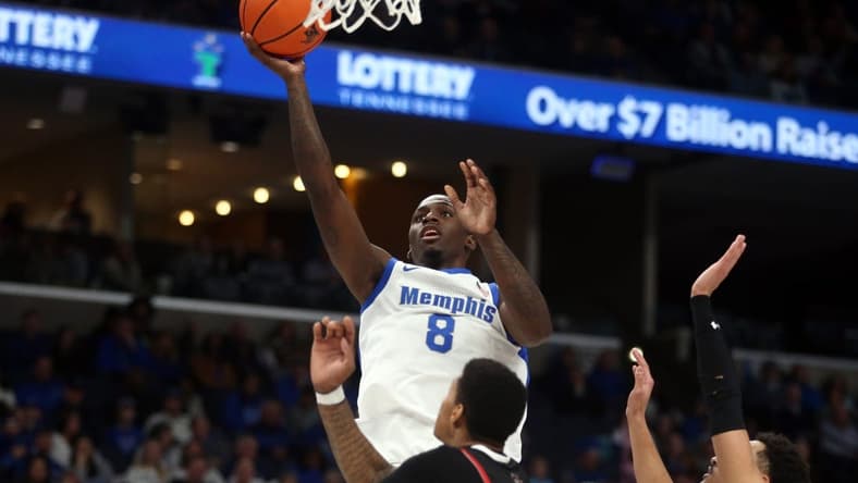 Dec 30, 2023; Memphis, Tennessee, USA; Memphis Tigers forward David Jones (8) shoots during the first half against the Austin Peay Governors at FedExForum. Mandatory Credit: Petre Thomas-USA TODAY Sports