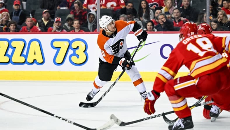 Dec 31, 2023; Calgary, Alberta, CAN; Philadelphia Flyers right wing Bobby Brink (10) takes a shot against the Calgary Flames during the second period at Scotiabank Saddledome. Mandatory Credit: Brett Holmes-USA TODAY Sports