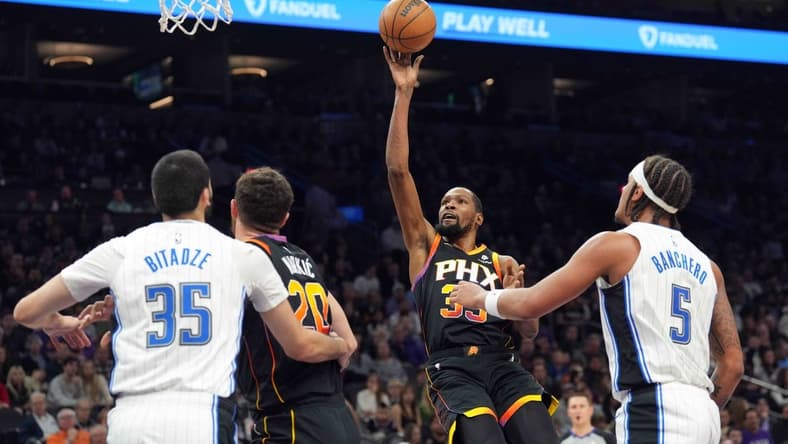 Dec 31, 2023; Phoenix, Arizona, USA; Phoenix Suns forward Kevin Durant (35) shoots against the Orlando Magic during the first half at Footprint Center. Mandatory Credit: Joe Camporeale-USA TODAY Sports