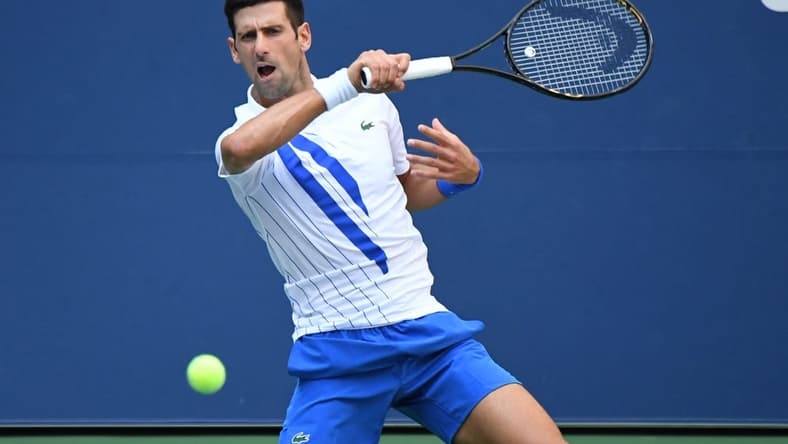 Sep 6, 2020; Flushing Meadows, New York, USA; Novak Djokovic of Serbia hits a forehand against Pablo Carreno Busta of Spain (not pictured) on day seven of the 2020 U.S. Open tennis tournament at USTA Billie Jean King National Tennis Center. Mandatory Credit: Danielle Parhizkaran-USA TODAY Sports