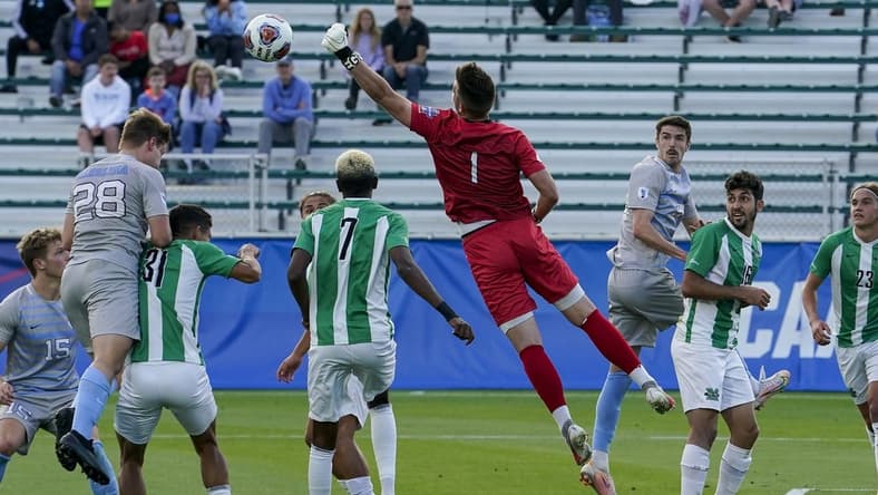 May 14, 2021; Cary, North Carolina, USA; Marshall goalkeeper Oliver Semmle (1) gets a block against North Carolina. Mandatory Credit: Jim Dedmon-USA TODAY Sports