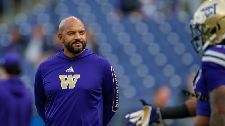Oct 16, 2021; Seattle, Washington, USA; Washington Huskies head coach Jimmy Lake watches pregame warmups against the UCLA Bruins at Alaska Airlines Field at Husky Stadium. Mandatory Credit: Joe Nicholson-USA TODAY Sports