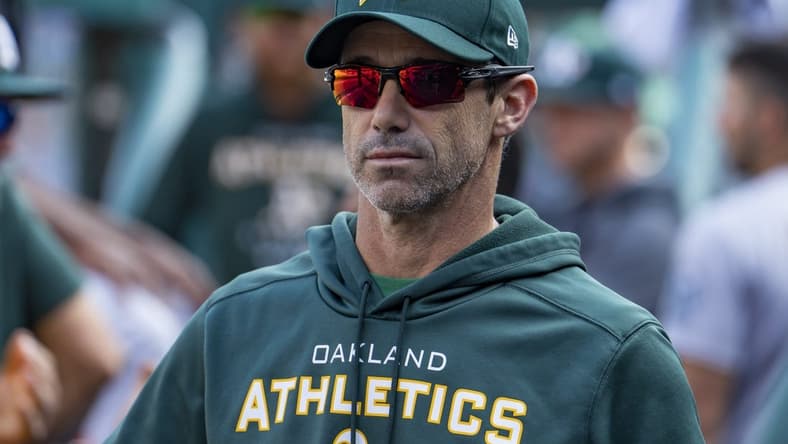 May 10, 2022; Detroit, Michigan, USA; Oakland Athletics bench coach Brad Ausmus (16) looks on from the dugout during the fourth inning against the Detroit Tigers at Comerica Park. Mandatory Credit: Raj Mehta-USA TODAY Sports