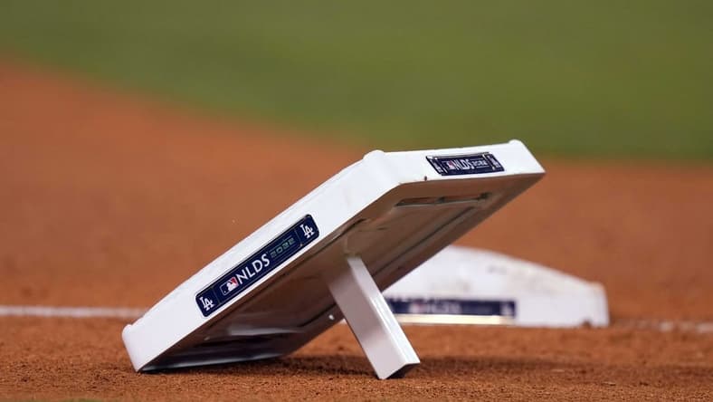 Oct 11, 2022; Los Angeles, California, USA; A detailed view of base with NLDS logo during during game at Dodger Stadium between the Los Angeles Dodgers and the San Diego Padres. Mandatory Credit: Kirby Lee-USA TODAY Sports