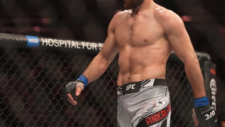 Dec 10, 2022; Las Vegas, Nevada, USA;  Magomed Ankalaev (blue gloves) reacts during the fight against Jan Blachowicz (red gloves) during UFC 282 at T-Mobile Arena. Mandatory Credit: Stephen R. Sylvanie-USA TODAY Sports