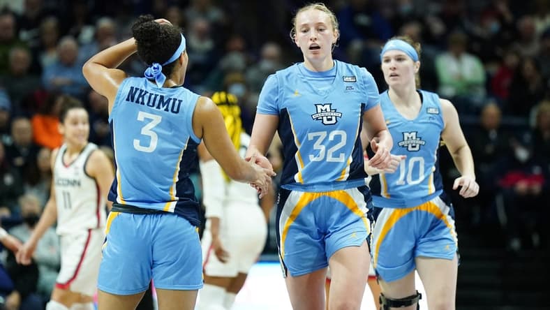 Dec 31, 2022; Storrs, Connecticut, USA; Marquette Golden Eagles forward Liza Karlen (32) and guard Rose Nkumu (3) react after a play against the UConn Huskies in the first half at Harry A. Gampel Pavilion. Mandatory Credit: David Butler II-USA TODAY Sports