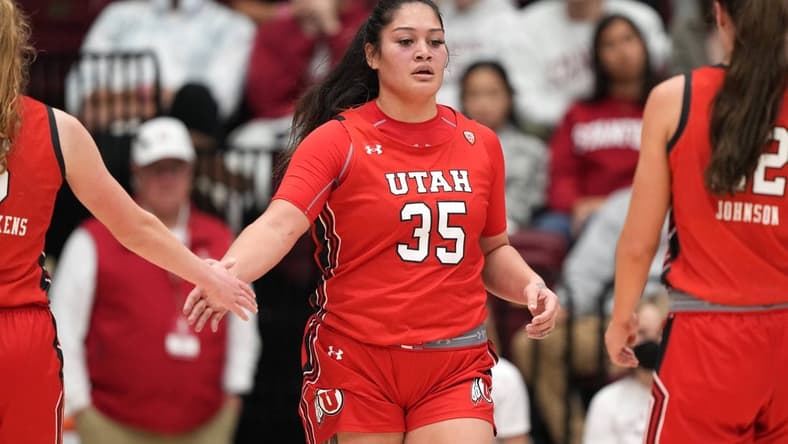 Jan 20, 2023; Stanford, California, USA; Utah Utes forward Alissa Pili (35) is congratulated by guard Gianna Kneepkens (left) and forward Jenna Johnson (right) during the third quarter against the Stanford Cardinal at Maples Pavilion. Mandatory Credit: Darren Yamashita-USA TODAY Sports
