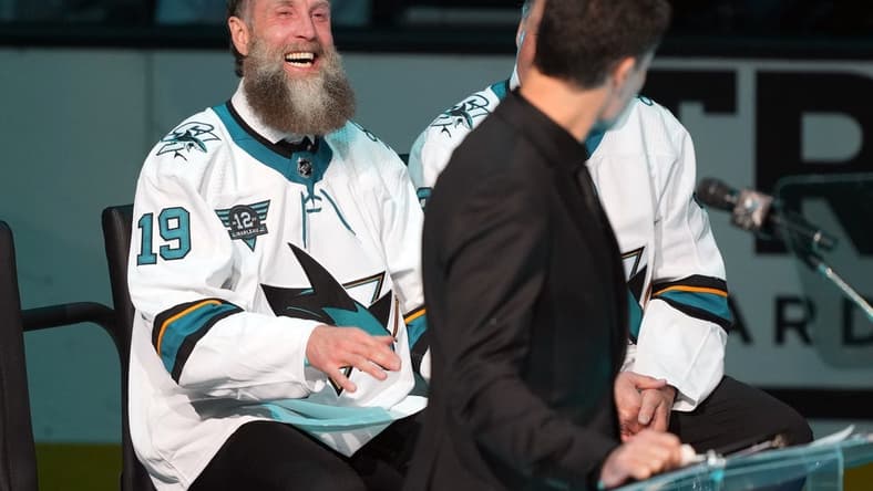 Feb 25, 2023; San Jose, California, USA; San Jose Sharks former player Joe Thornton laughs during the Patrick Marleau jersey retirement ceremony before the game against the Chicago Blackhawks at SAP Center at San Jose. Mandatory Credit: Darren Yamashita-USA TODAY Sports