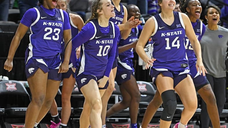 Mar 10, 2023; Kansas City, MO, USA;  Kansas State Wildcats guard Mimi Gatewood (23), Mikayla Parks (10) and Rebekah Dallinger (14) reacts after a Wildcat score during the first half against the Texas Longhorns at Municipal Auditorium. Mandatory Credit: Peter Aiken-USA TODAY Sports