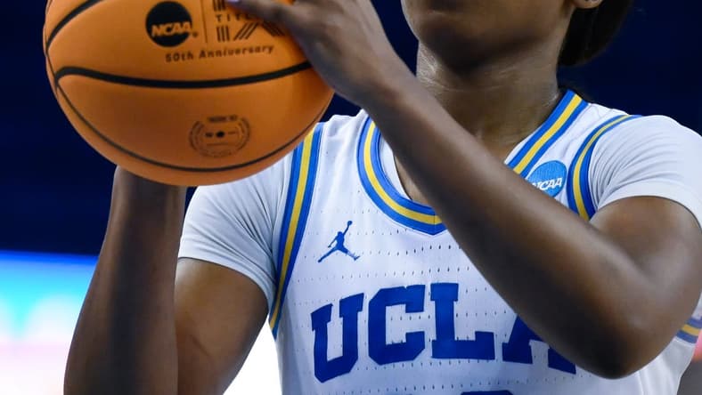 Mar 20, 2023; Los Angeles, CA, USA; UCLA Bruins guard Charisma Osborne (20) shoots a free throw in the closing minute of an NCAA Tournament Women s 2nd Round game against the Oklahoma Sooners at Pauley Pavilion. Mandatory Credit: Robert Hanashiro-USA TODAY Sports