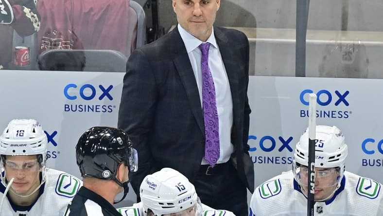 Apr 13, 2023; Tempe, Arizona, USA; Vancouver Canuck head coach Rick Tocchet watches game action in the first period against the Arizona Coyotes at Mullett Arena. Mandatory Credit: Matt Kartozian-USA TODAY Sports