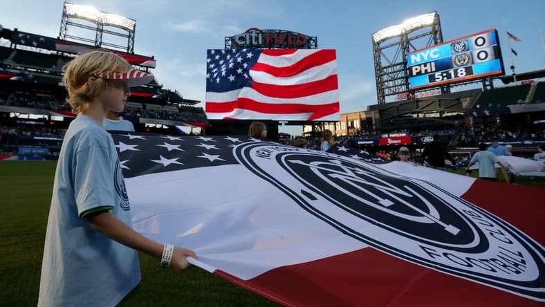 May 27, 2023; Flushing, New York, USA; A young fan holds a banner during the national anthem before a match between New York City FC and the Philadelphia Union at Citi Field. Mandatory Credit: Brad Penner-USA TODAY Sports