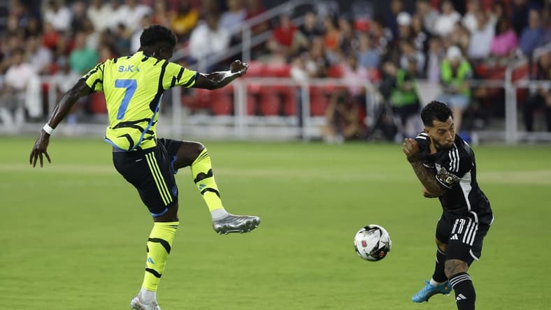 Jul 19, 2023; Washington, DC, USA; MLS All-Stars midfielder Luciano Acosta (11) blocks the shot of Arsenal midfielder Bukayo Saka (7) in the 2023 MLS All Star Game at Audi Field. Mandatory Credit: Geoff Burke-USA TODAY Sports