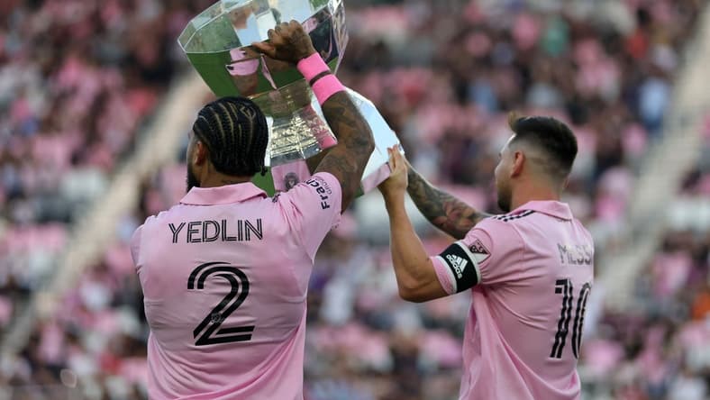 Aug 30, 2023; Fort Lauderdale, Florida, USA; Inter Miami defender DeAndre Yedlin (2) and forward Lionel Messi (10)  hoist the Leagues Cup trophy before the game against Nashville SC at DRV PNK Stadium. Mandatory Credit: Sam Navarro-USA TODAY Sports